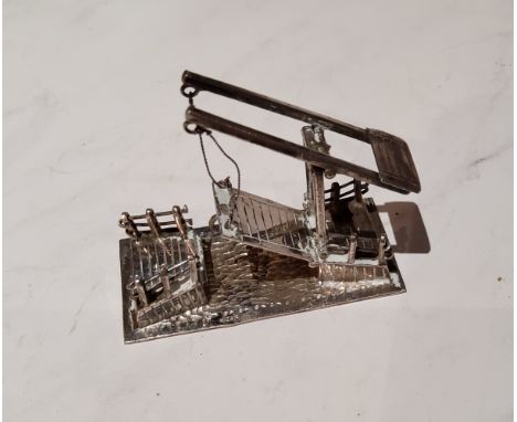 A Dutch silver coloured metal miniature model of a bridge, 5cm wide 