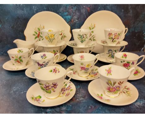 A Royal Albert Holly pattern teacup and saucer, milk jug and two bread and butter plates, printed marks;&nbsp; other Royal Al
