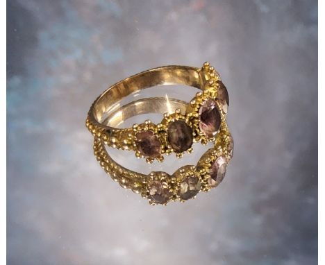 An early Victorian yellow metal etruscan style trilogy ring, set with five graduated pink topaz oval stones, size M, 2.85g 