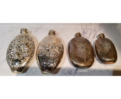 An E.P.B.M.&nbsp; oval hip flask, embossed with cherubs, 13.5cm high;&nbsp; another, embossed with roses;&nbsp; &nbsp;a plate