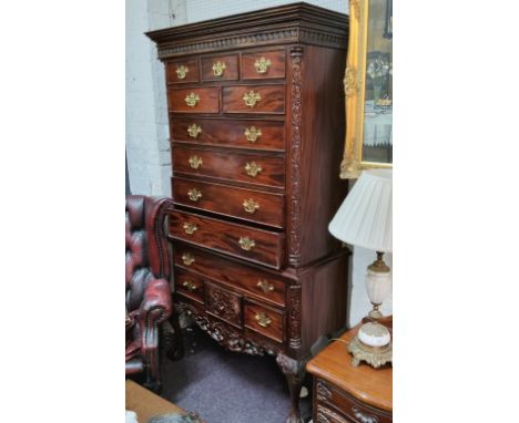 A Chippendale style hardwood chest on stand,&nbsp; of thirteen drawers, the base with one long and three small drawers above 