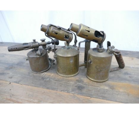 Vintage Sievert No12 brass blowtorch, Blaydon B62 brass blowtorch, and Optimus 411 paraffin blowtorch.
