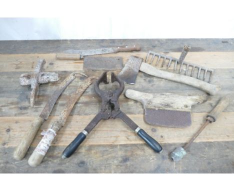 Box containing vintage Burdizzo castration pliers, old shepards turnip hooks, meat cleaver, chopper etc.  These bladed produc