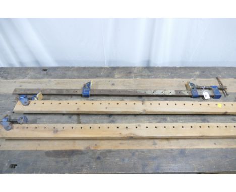 3 sash clamps, 1 metal, 2 wooden, with lengths between 122cm and 180cm.