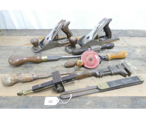 Collection of woodworking tools which include 2 Stanley planes and hand drill.