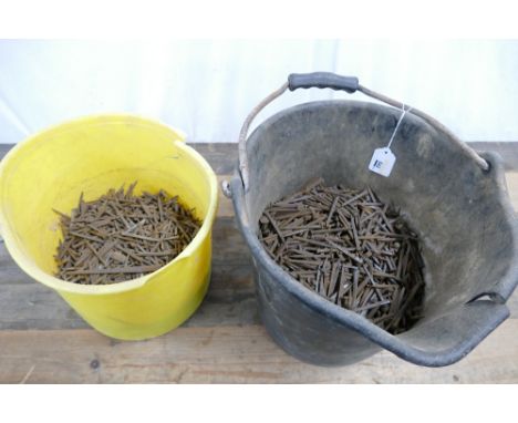 Two buckets of vintage iron nails.