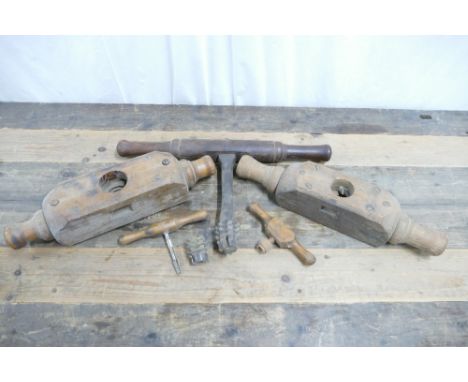 Collection of internal and external vintage wood threading tools.
