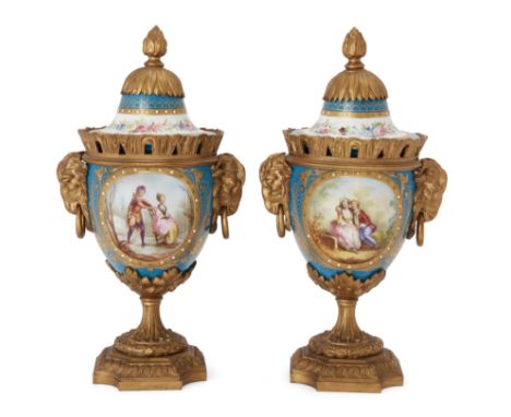 A pair of gilt-bronze mounted Sevres style vases and covers, third quarter 19th century, the bodies decorated with courting c