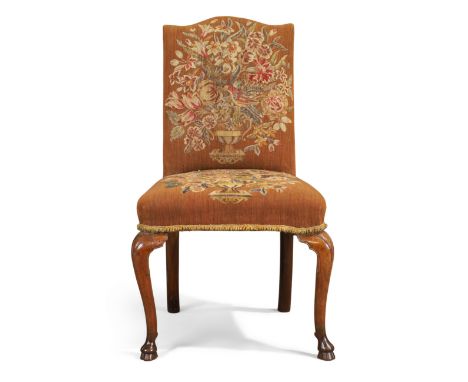 A George I walnut side chair, first quarter 18th century, with floral tapestry upholstery, on cabriole front legs to hoof fee