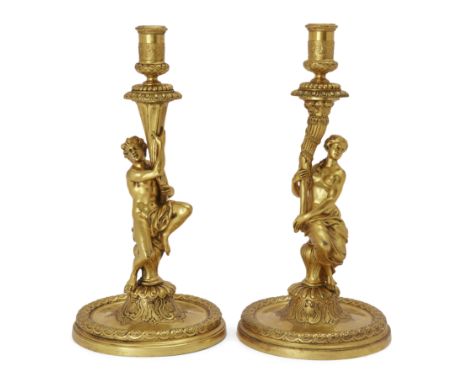 A pair of French gilt-bronze figural candlesticks, in the manner of Corneille van Clève (1646-1732), second half 19th century