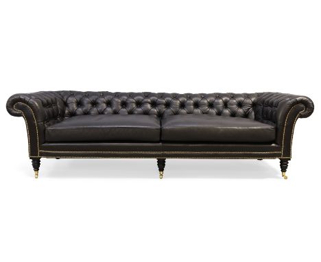 A Ralph Lauren black leather chesterfield sofa, button-back and stud-bound upholstery, on turned front feet and castors, 78cm