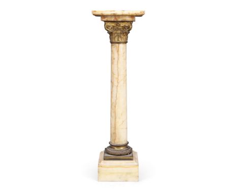 A gilt-bronze mounted onyx pedestal column, early 20th century, the square plateau above a Corinthian capital and laurel band