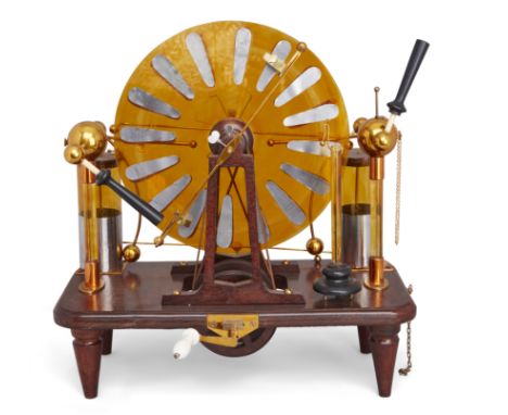 A Wimshurst electrostatic machine, second half 20th century, on a mahogany base bearing plaque inscribed Scientific Developme