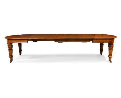 A Victorian Aesthetic movement oak dining table by Marsh, Jones and Cribb, third quarter 19th century, part-ebonised, with th