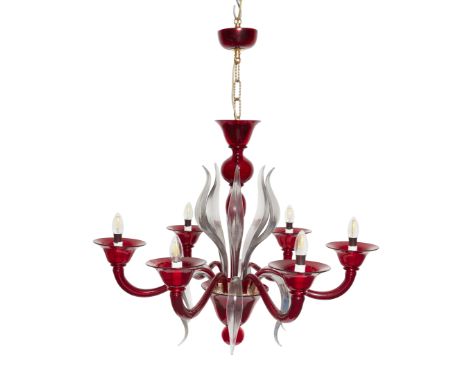 A modern Murano clear and cranberry glass six-light chandelier, the baluster stem supporting scroll branches and leafy fronds