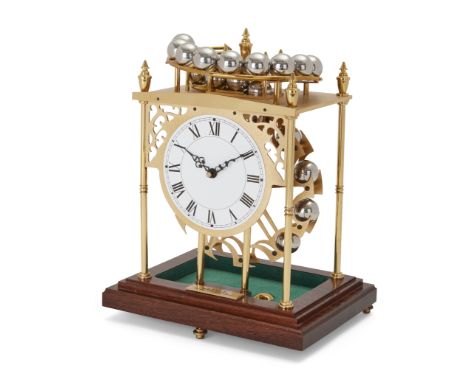 A modern spherical weight clock, the silvered dial with Roman numerals, the gilt-brass case with sloping rail feeding chrome 