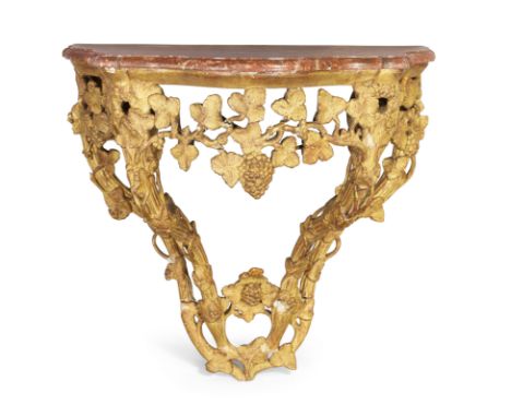 A French giltwood and gesso serpentine front console table, first quarter 19th century, marble top on carved and pierced base