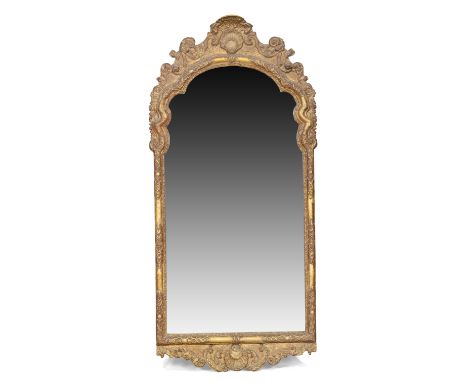 A French giltwood pier mirror, first quarter 19th century,&nbsp;the rectangular plate with shaped top set in moulded frame, w