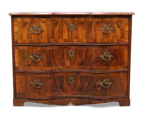 A walnut serpentine front commode, third quarter 18th century, possibly Maltese, the crossbanded top above three drawers, on 