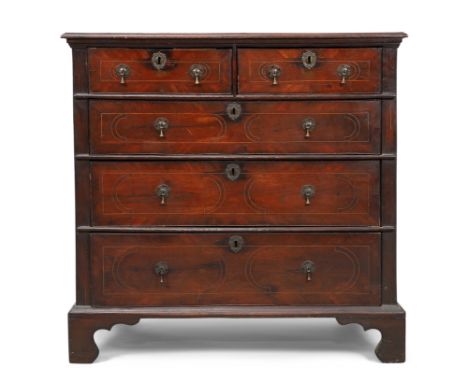A George I inlaid oak chest, first quarter 18th century, walnut crossbanded, two short and three long drawers, on carved brac