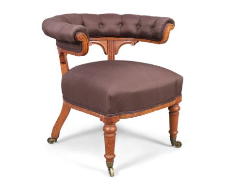 A Victorian oak horseshoe back chair, by Holland & Sons, third quarter 19th century, upholstered in a brown silk, on turned f