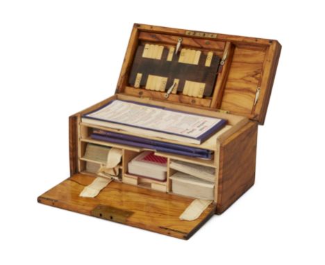 An Edwardian walnut playing card compendium, by Charles Goodall, c.1910, the hinged lid and fall-front marked in gilt on blac