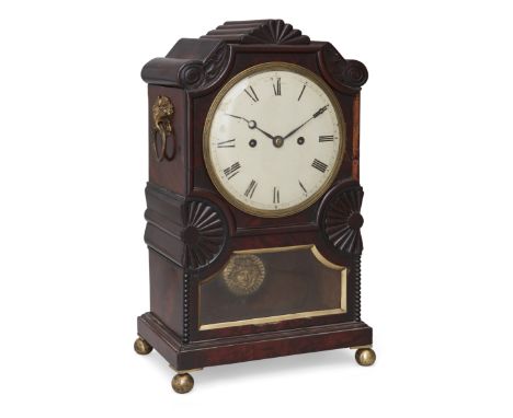 A William IV mahogany bracket clock, second quarter 19th century, the case with carved foliate, scrolling and fan decoration 