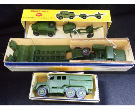 DINKY TOYS; A DINKY SUPERTOYS TANK TRANSPORTER (660), a Medium Artillery Tractor (689) and a 25-Pounder field gun set (697) (