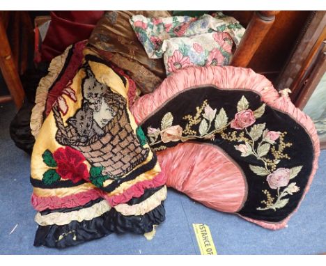 A VICTORIAN CUSHION IN THE FORM OF A FAN, a 19th century silk panel painted with Gothic motifs (examine) and other textiles