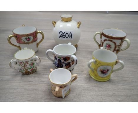 A ROYAL WORCESTER VASE and a collection of miniature tygs