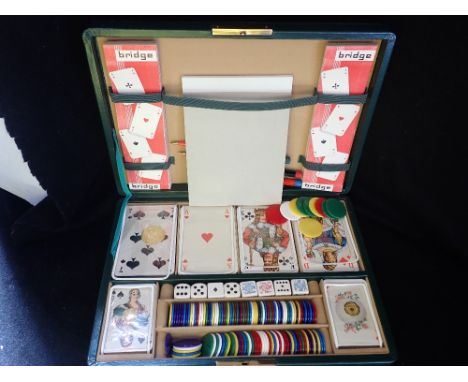 A BRIDGE AND PLAYING CARD SET in a fitted green leather case