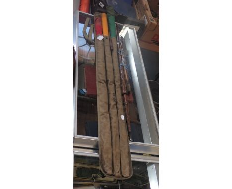 A SET OF THREE VINTAGE SAFETY FLAGS, yellow, red and green, in a canvas case, gun cleaning rods and sundries