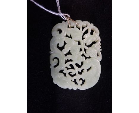 A CARVED JADE OPENWORK PENDANT, 6CM X 4.3CM, with double ring suspension