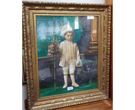 AN EARLY 20TH CENTURY OVERPAINTED PORTRAIT of a little boy wearing fancy dress costume in a gilt frame