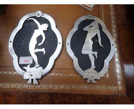 A PAIR OF ART DECO CHROME PLATED CUT OUT WALL PLAQUES depicting nude women