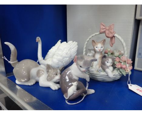 LLADRO; THREE STUDIES OF KITTENS and a swan (4) (all boxed)