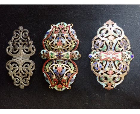 A SILVER OPENWORK BUCKLE, together with two gilt and enamel buckles (3)