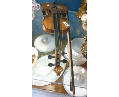 A Violin and Bow, the interior with printed Stradivarius label.