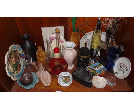 A Shelf of Decorative Items to include an antique milk crock, old iron and lava lamp.