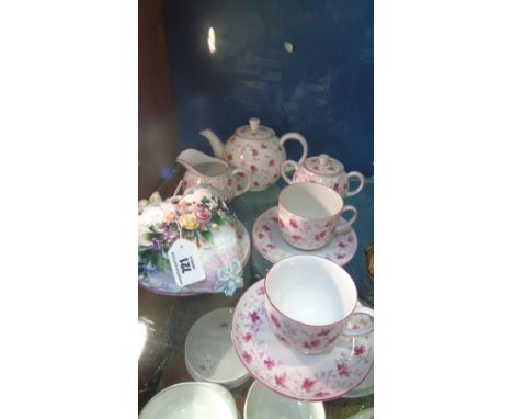 A Bavarian Tea Set for Two, decorated in trailing pink flowers and comprising of a teapot, milk jug, sugar bowl and two cups,