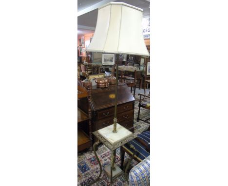 A Brass and Onyx Standard Lamp