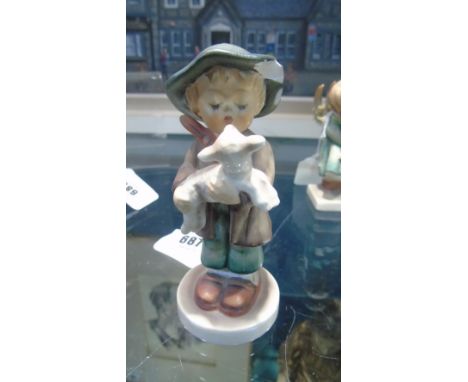 A Goebel Figure Of A Boy Holding A Sheep (A/F).