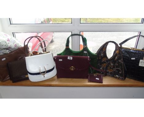 One Shelf Of Handbags, including a matching Gucci bag and wallet.