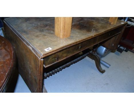 A Mid 19th Century Mahogany Sofa Table with flame grain top and a twin drawer freeze.  