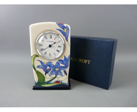 A MOORCROFT 'FLY AWAY HOME' MANTEL CLOCK, designed by Rachel Bishop, decorated on a cream ground, impressed 'Moorcroft' with 