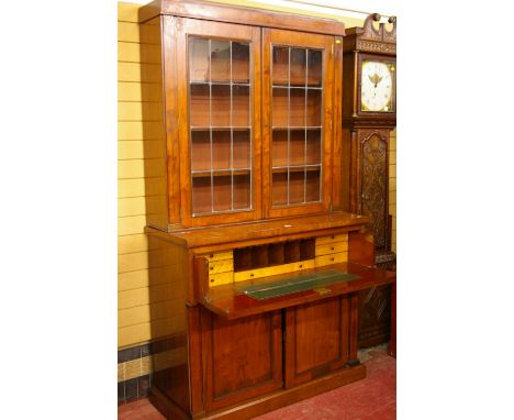 A VICTORIAN MAHOGANY SECRETAIRE BOOKCASE, the upper section having twin twelve pane leaded glazed doors and interior adjustab