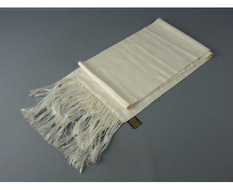 A BIBA CREAM SILK SCARF, 145 x 20 cms with long tasselled ends (two small stains near one end)