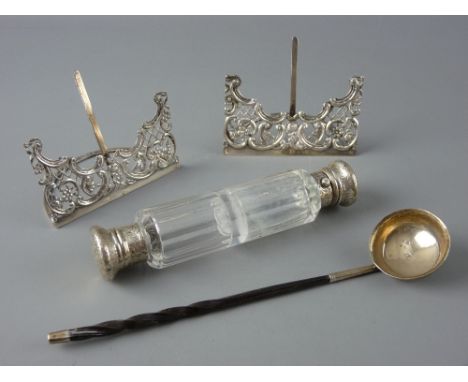 A TODDY LADLE with twisted horn handle, two pierced card or menu holders and a clear glass double ended scent bottle with cha