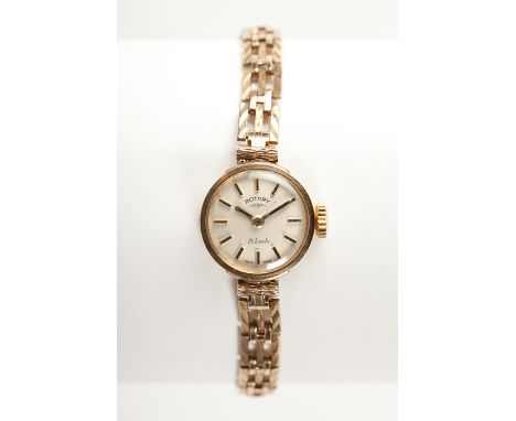 LADY'S NINE CARAT GOLD ROTARY WRIST WATCH the dial with baton numerals on a nine carat gold bracelet strap