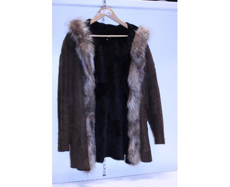 A vintage suede coat with fur trim 